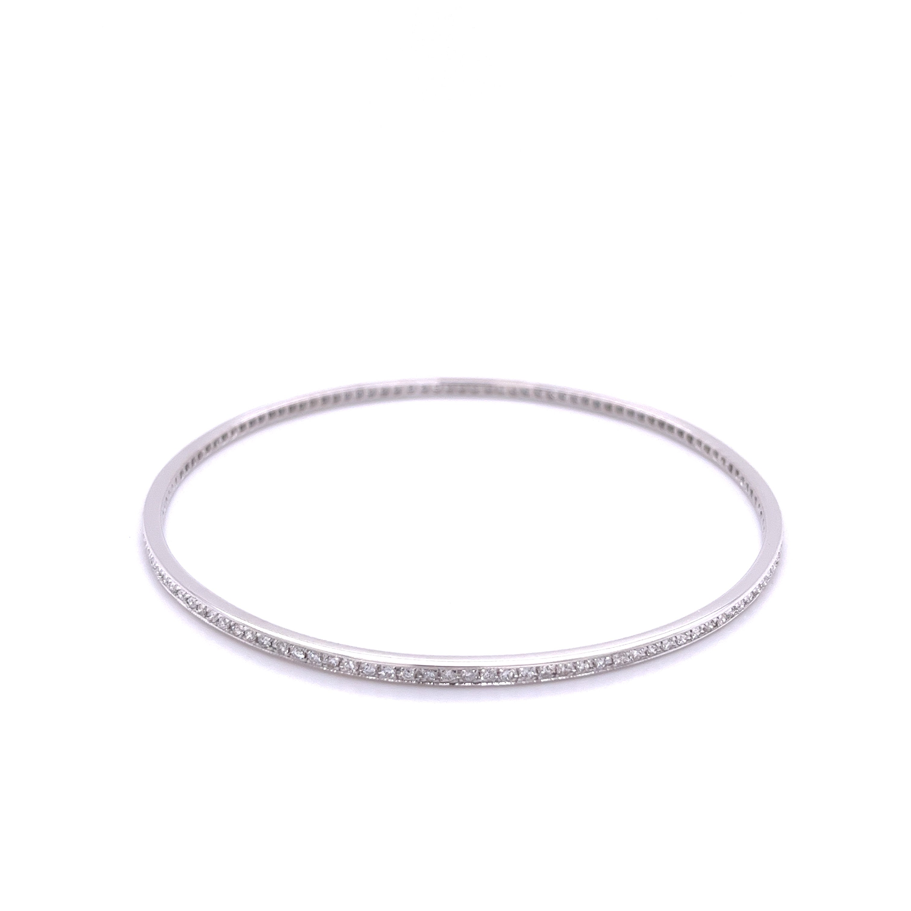Modern style jewelry example of a simple diamond bangle