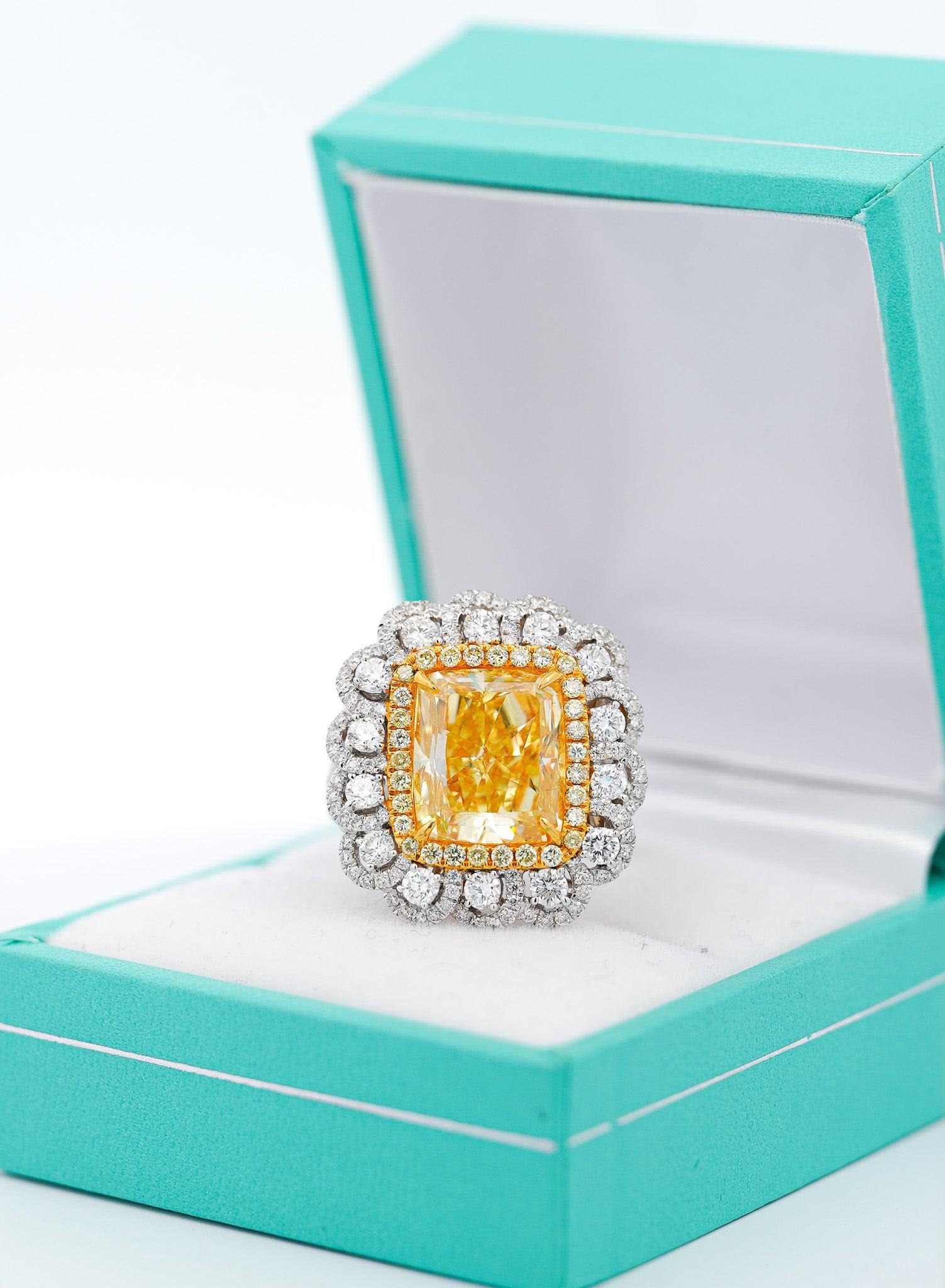 7 Carat Fancy Intense Yellow Radiant Cut Diamond and Diamond Halo Ring | GIA Certified