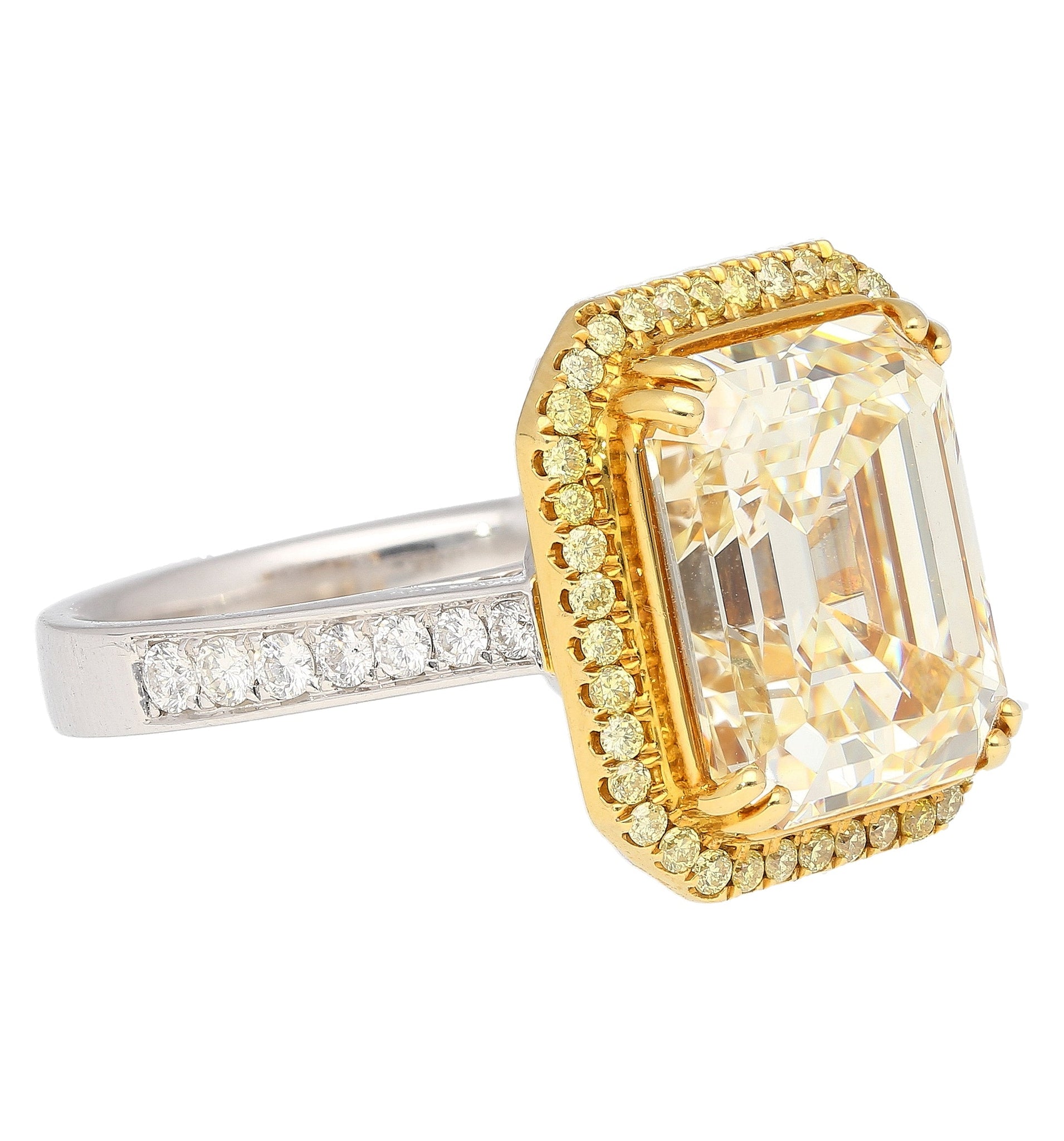 Emerald Cut Natural 7.25 Carat Fancy Light Yellow Diamond with Round Diamond Halo Ring