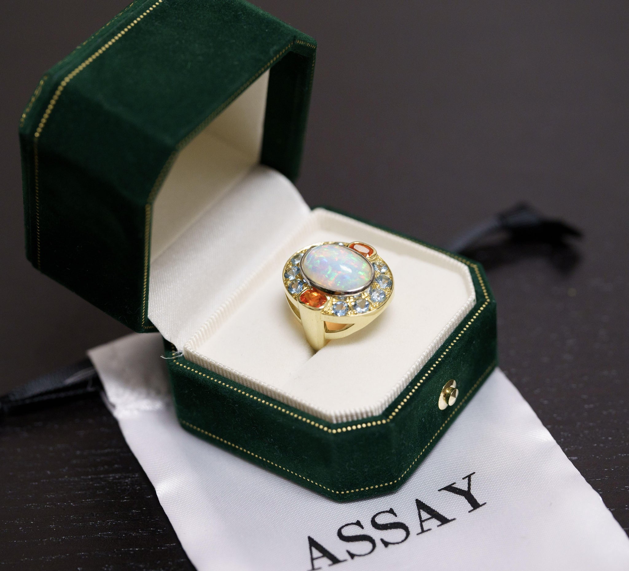 GIA Certified 8 Carat White Opal With Orange Garnet & Aquamarine Halo Ring