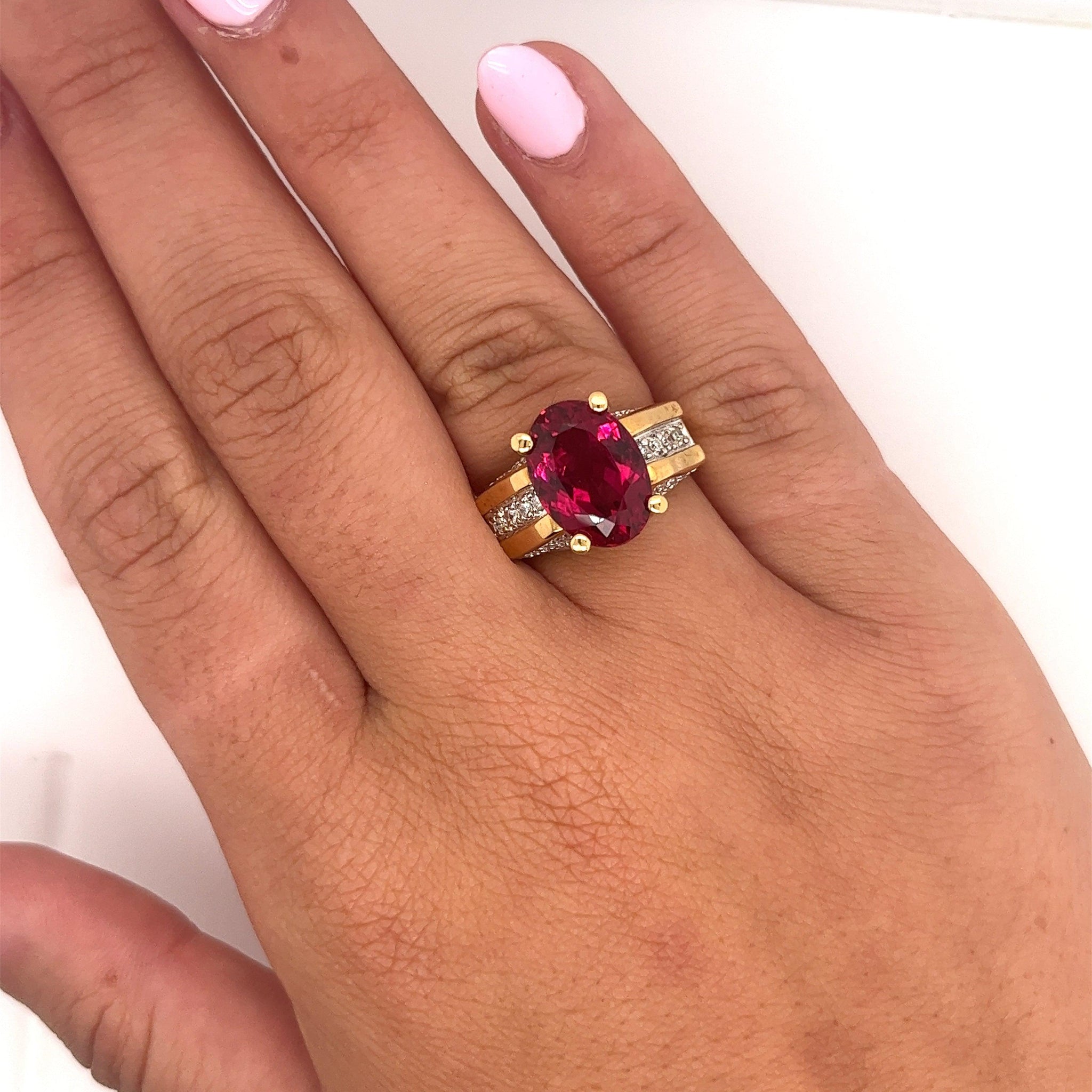 GIA Certified Oval Cut 7 Carat Purplish Red Tourmaline Ring with Diamond Sides in 18K Gold