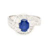 Natural 1.14 Carat Oval Cut Blue Sapphire with Round & Baguette Cut Diamonds in a Swirled 18K White Gold Ring Setting-Rings-ASSAY