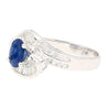 Natural 1.14 Carat Oval Cut Blue Sapphire with Round & Baguette Cut Diamonds in a Swirled 18K White Gold Ring Setting-Rings-ASSAY