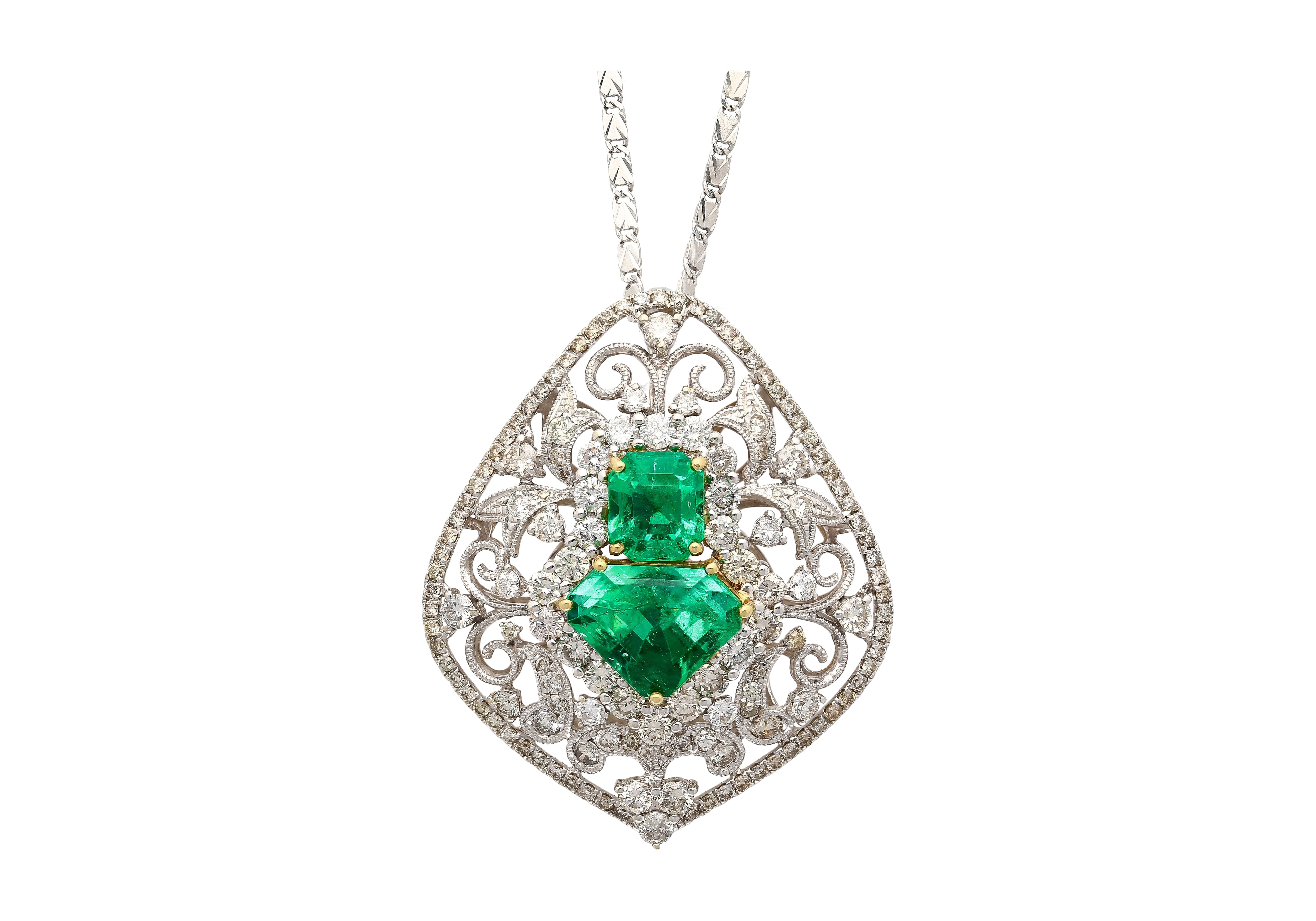 Vintage-Art-Nouveau-Style-Carved-18K-White-Gold-Pendant-Necklace-With-Shield-Cut-Emerald-and-Diamond-Side-Stones-Necklace.jpg